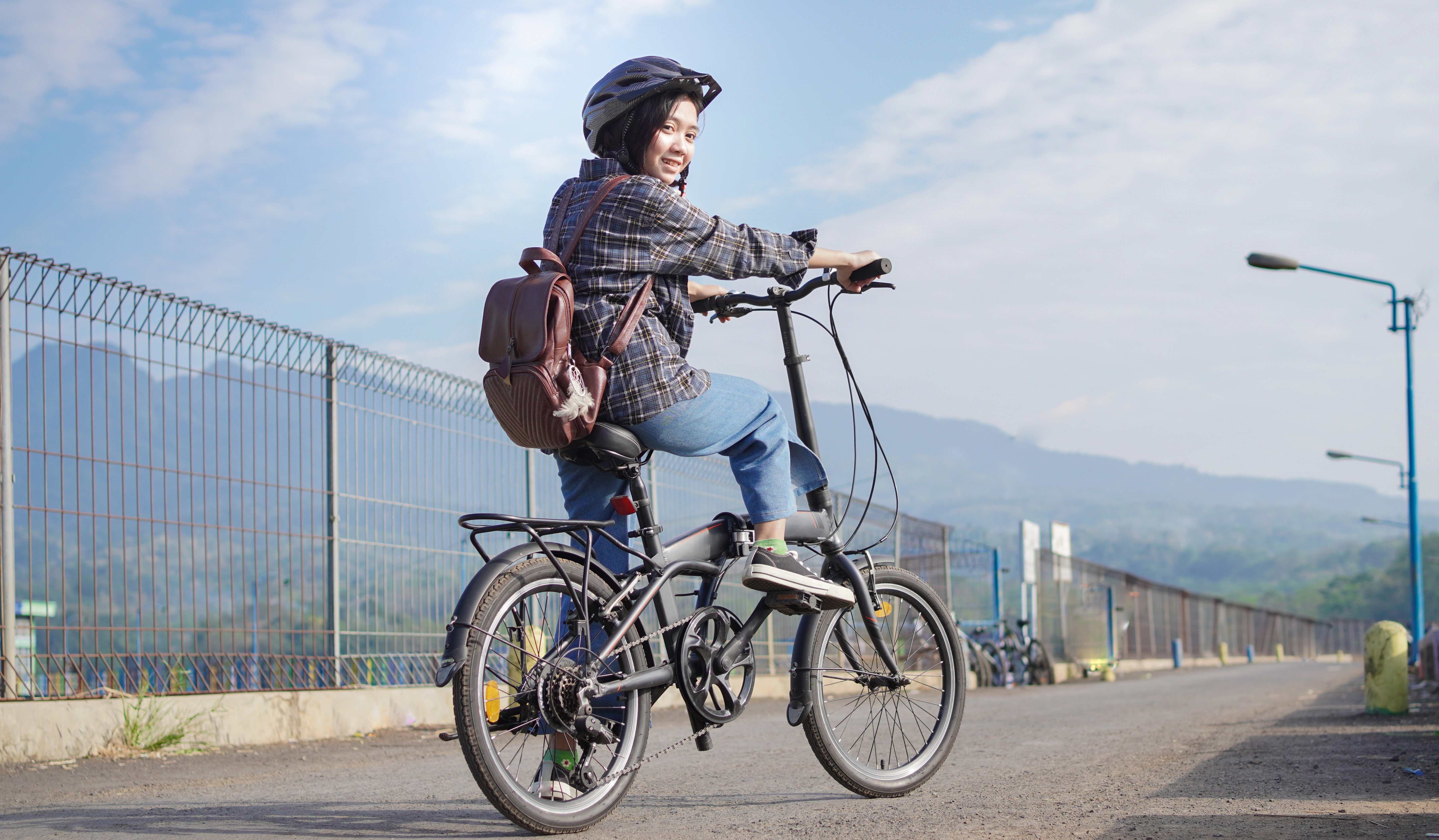 young-asian-woman-break-ride-bicycle-before-go