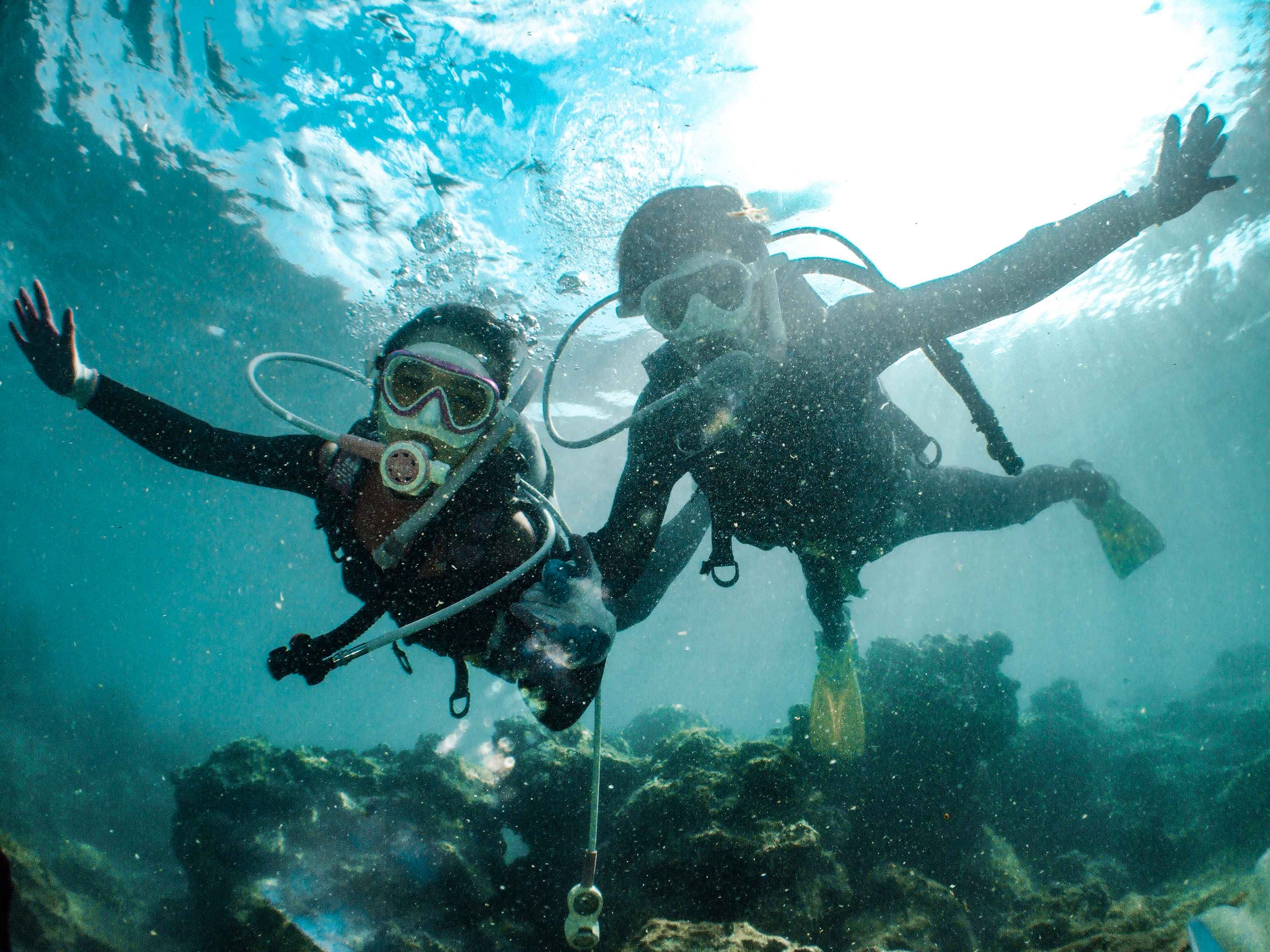 underwater-shot-of-two-people-diving